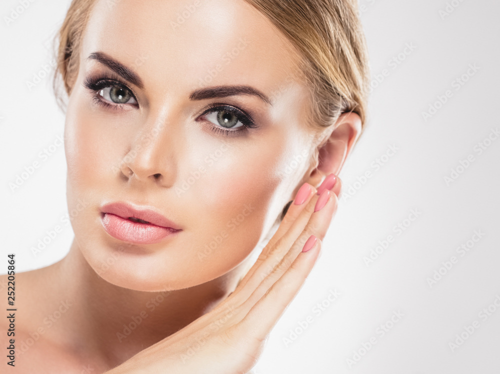Beautiful woman blonde hair face close up portrait studio on white Beautiful woman blonde hair face close up portrait studio on white