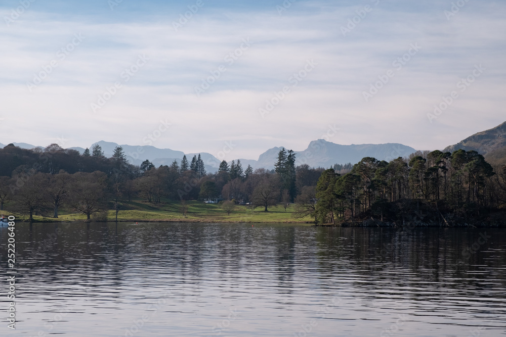 The Langdale Pikes and Bowfell seen over Windermere, Lake District, UK The Langdale Pikes and Bowfell seen over Windermere, Lake District, UK