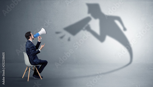Принти на полотні Small businessman staying and offering stuffs to his bossy yelling shadow