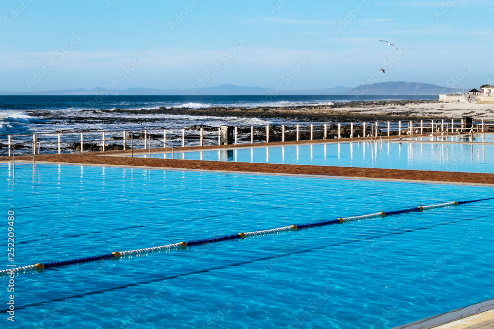 Sea Point Pavilion, an outdoor swimming pool with sea salt water and a  stunning view on the Atlantic Ocean in Cape Town, South Africa Stock Photo  | Adobe Stock