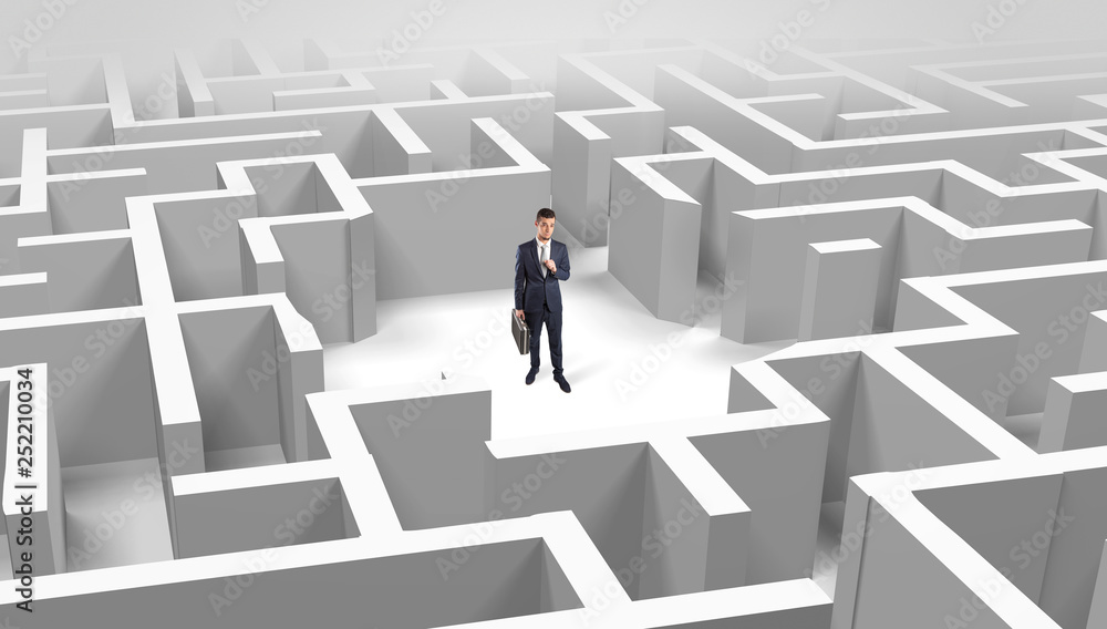 Young businessman standing in a middle of a 3D maze
Young businessman standing in a middle of a 3D maze