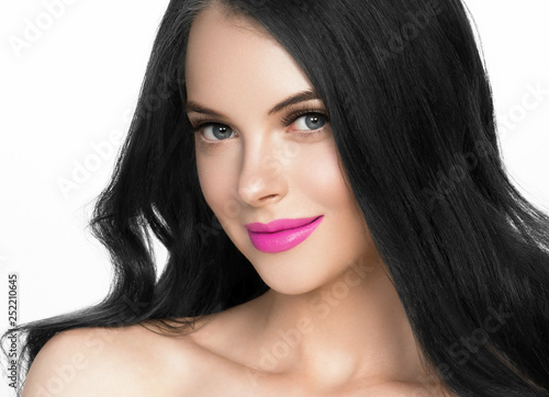 Brunette woman with long black hair and pink lipstick lips, female with beautiful eyes with lash extensions 