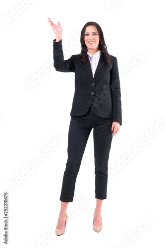Happy elegant business woman waving hand welcoming and smiling at camera. Full body isolated on white background. 