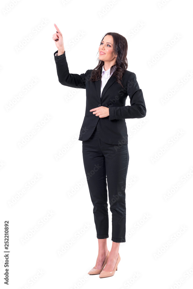 Friendly smiling business woman pointing finger using touch screen on virtual reality. Full body isolated on white background. Friendly smiling business woman pointing finger using touch screen on virtual reality. Full body isolated on white background.