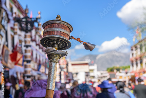 hand prayer wheel in Jokhang temple. The characters written (in Newari language) on the wheels are the mantras 