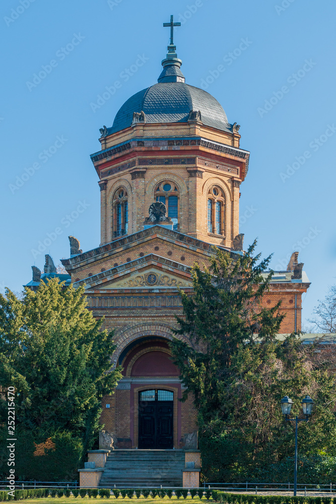 Old cemetery chapel in a park in sunny weather and blue sky Old cemetery chapel in a park in sunny weather and blue sky