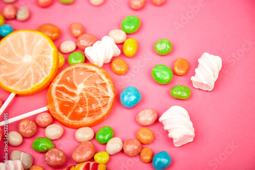 Colorful candy, jelly, lollipop on stick, scattering of multicolored sweets