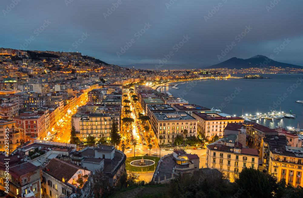 Naples, Italy. Evening city car traffic and the sea bay