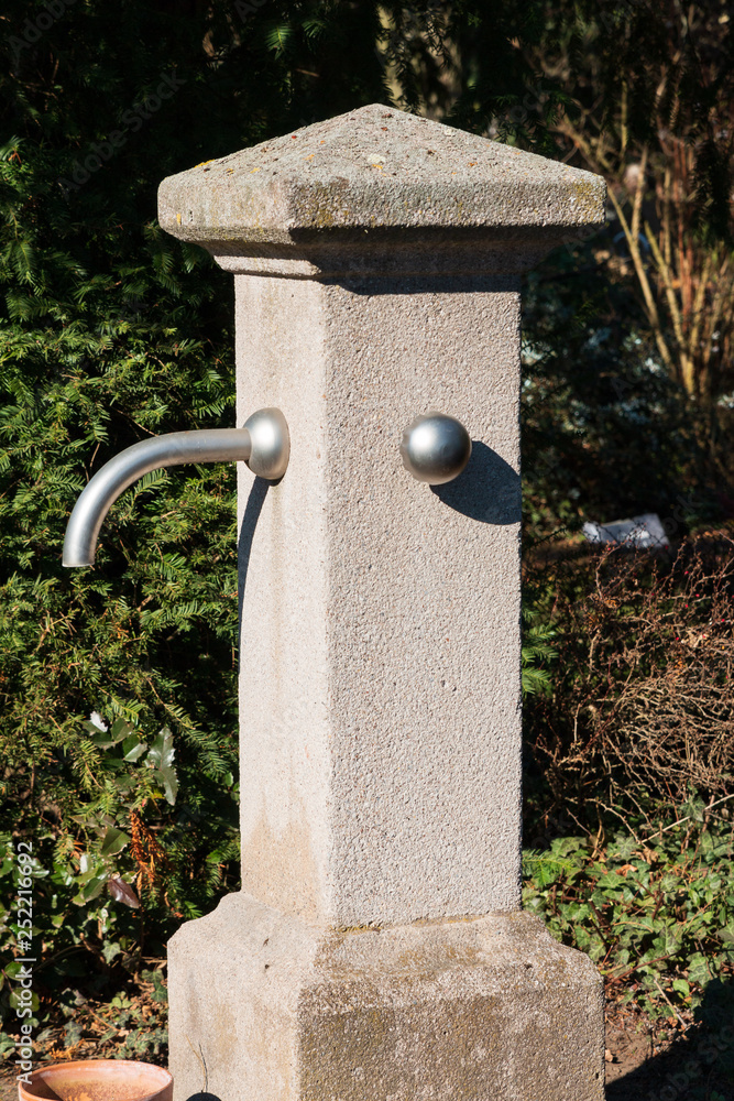 Concrete pillar Water dispenser in a park