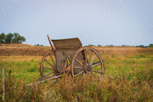Gun carriage with large wheels for iron old cannon photo