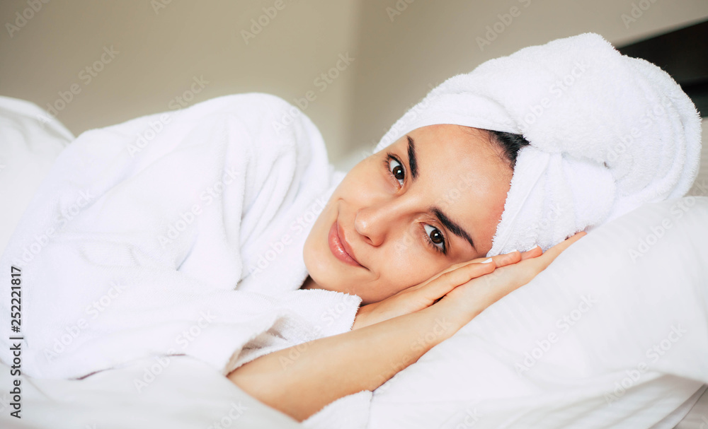 Wakefulness. Naturally fabulous girl on her big bed looking right into the camera with her stunning hazel eyes and pretty face. Wakefulness. Naturally fabulous girl on her big bed looking right into the camera with her stunning hazel eyes and pretty face.
