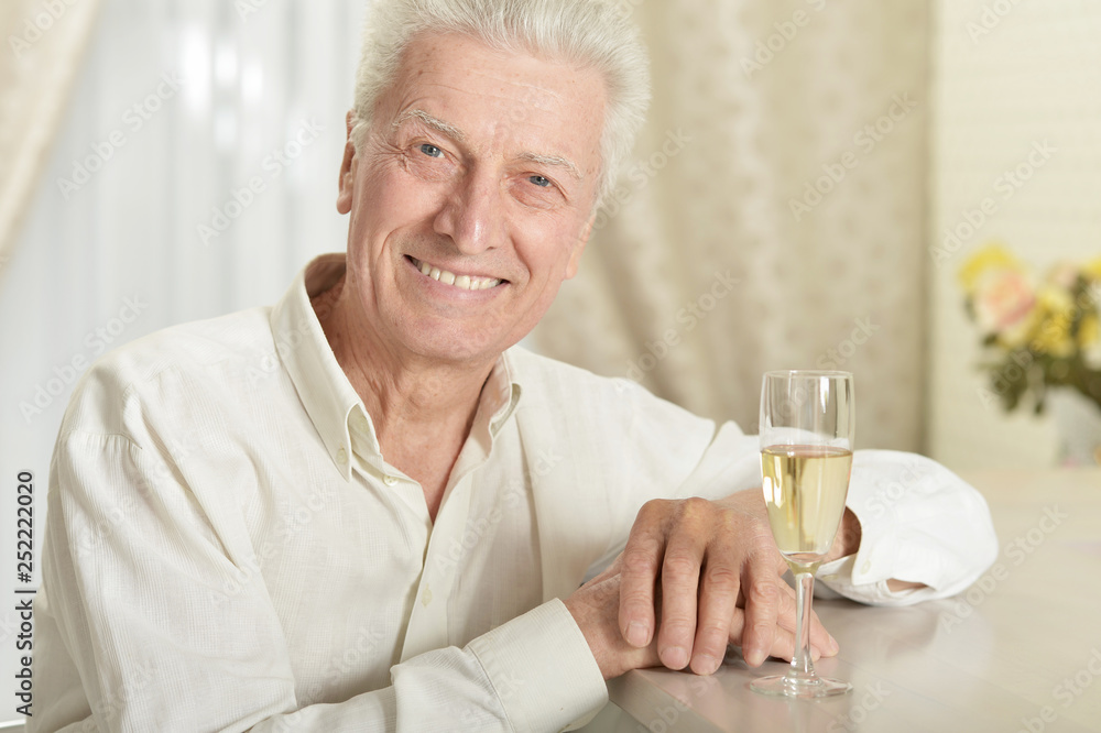 Portrait of happy senior man with champagne Portrait of happy senior man with champagne