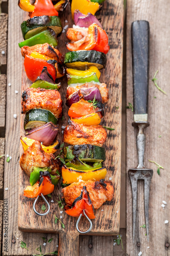 Spicy grilled skewers made of meat and vegetables