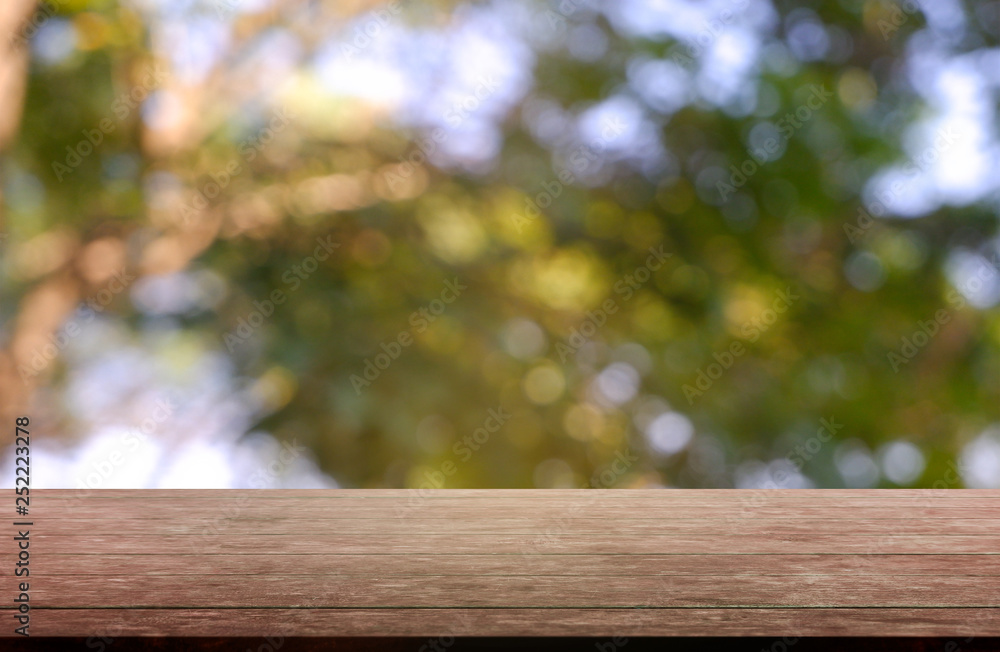 Empty wooden table in front of abstract blurred green of garden and nature light background. For montage product display or design key visual layout - Image Empty wooden table in front of abstract blurred green of garden and nature light background. For montage product display or design key visual layout - Image