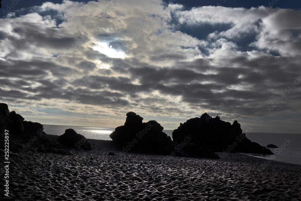 Rocks, clouds and sea