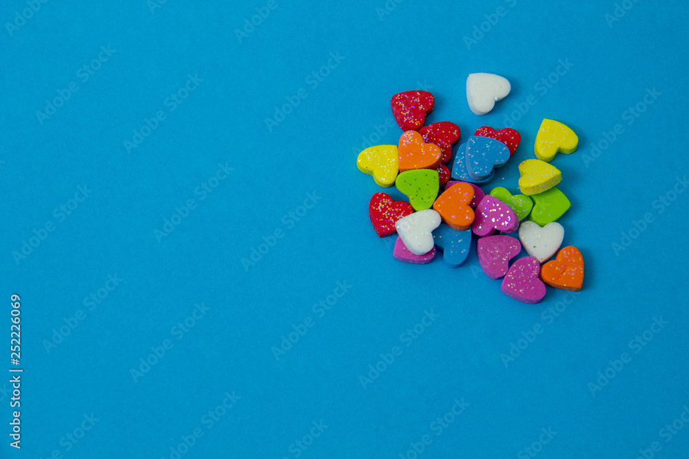 A multicolored hearts shape  on blue sky background, image using for valentine ‘s day signs and lovely sweet concept