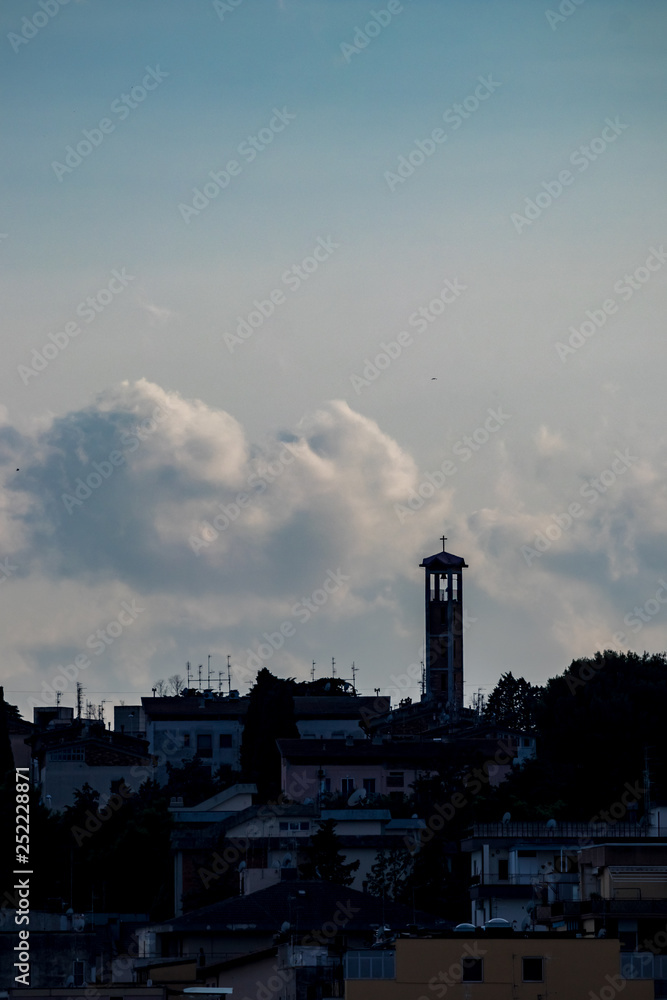 Amazing sky and church silhouette view of ancient town of Matera, the Sassi di Matera, Basilicata, Southern Italy, cloudy summer afternoon just before sunset
