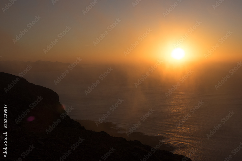 Panoramic view from the Mirador del Rio in Lanzarote during sunset with the island of La Graciosa Panoramic view from the Mirador del Rio in Lanzarote during sunset with the island of La Graciosa