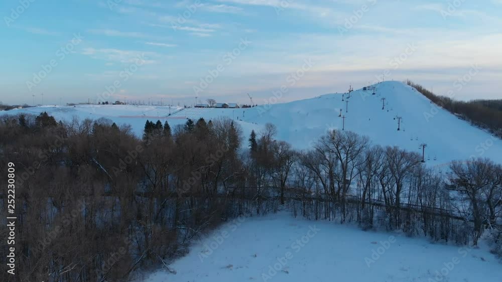 Snow park in Wisconsin, winter activities (tubing, skiing, snowboarding). Drone shots , bird's eyes view Snow park in Wisconsin, winter activities (tubing, skiing, snowboarding). Drone shots , bird's eyes view
