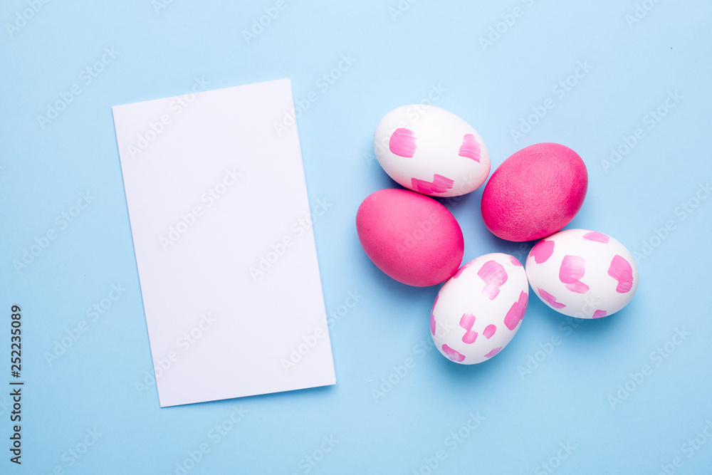 Greeting card and easter eggs with watercolor brushstrokes