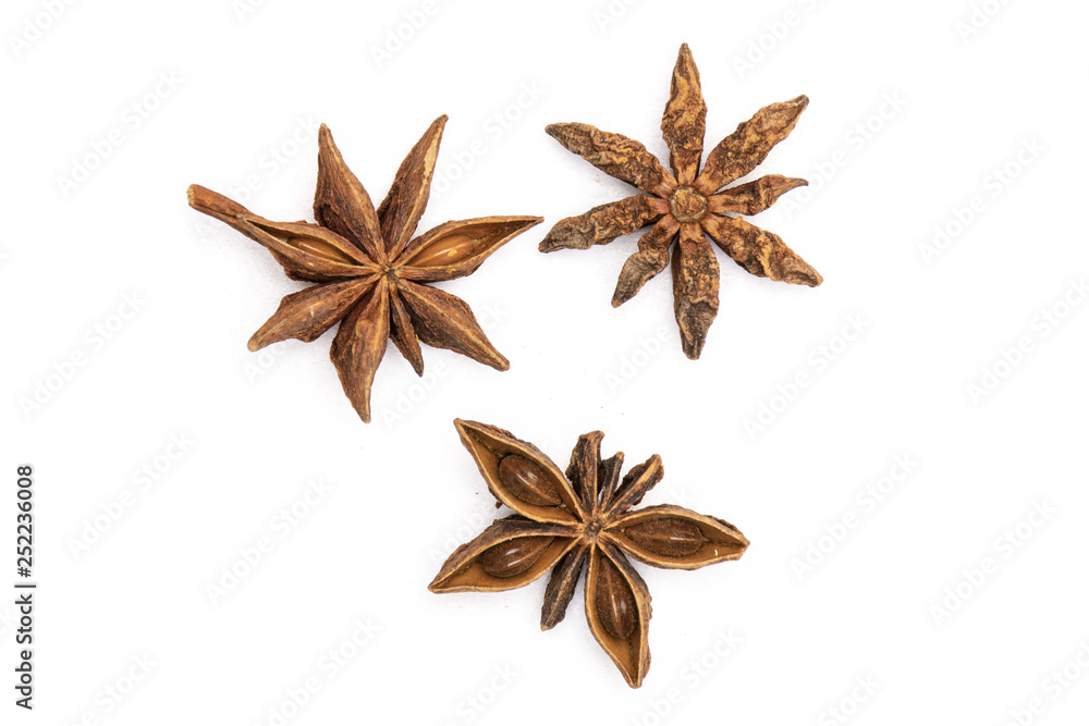 Group of three whole dry brown star anise fruit flatlay isolated on white background Group of three whole dry brown star anise fruit flatlay isolated on white background
