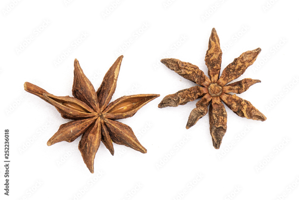 Group of two whole dry brown star anise fruit flatlay isolated on white background Group of two whole dry brown star anise fruit flatlay isolated on white background