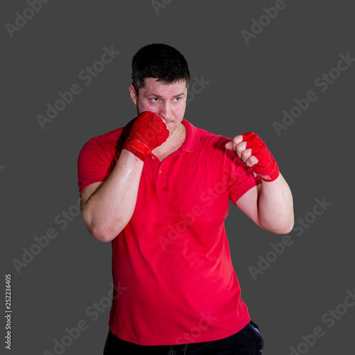 White male boxer in Boxing stand during training isolated on grey background 10