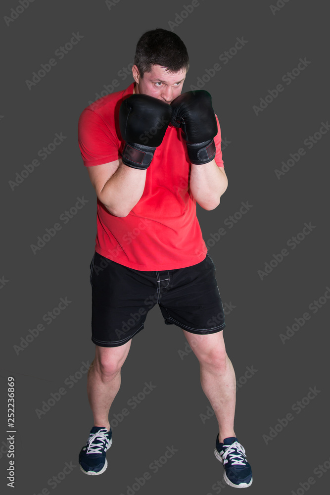 White male boxer in Boxing stand during training isolated on grey background 6 White male boxer in Boxing stand during training isolated on grey background 6