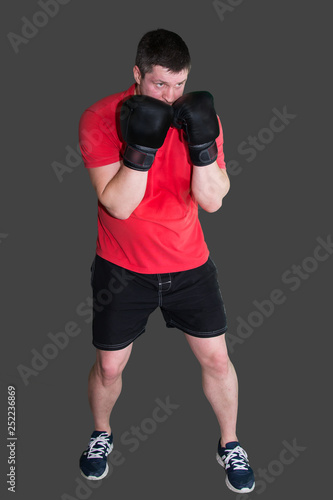 White male boxer in Boxing stand during training isolated on grey background 6
