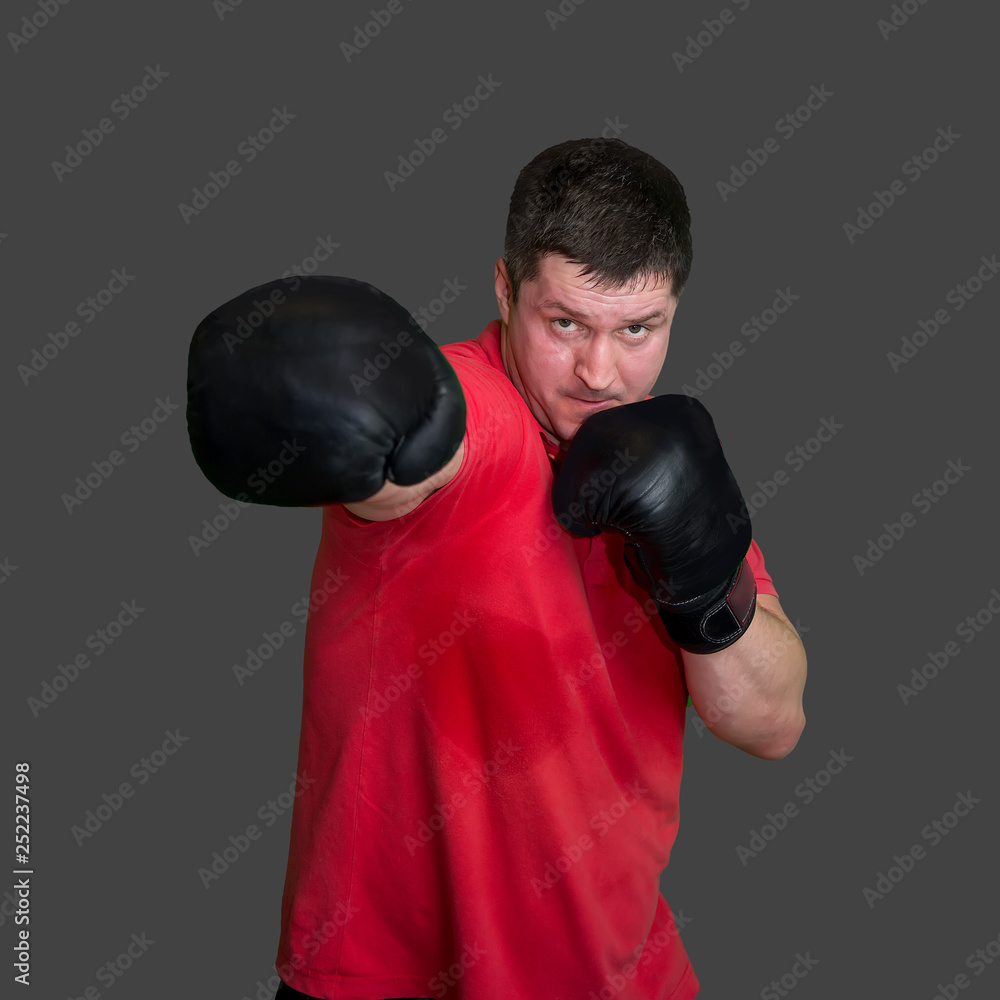 White male boxer in Boxing stand during training isolated on grey background