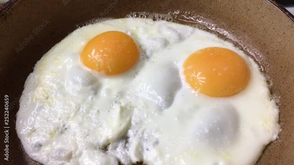 Cooking eggs in a frying pan. Top view. Cooking eggs in a frying pan. Top view.