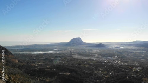 Aerial drone view of Segaria mountain, in Marina Alta, Alicante, Spain. Denia and Montgó mountain are in the background photo