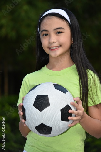Happy Female Athlete With Soccer Ball © dtiberio