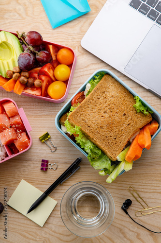 Quadro su tela Flat lay with healthy lunch dishes variety: sandwich, salad and fruit snacks