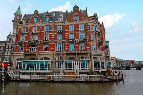 Medieval building along the river Amstel in Amsterdam Netherlands