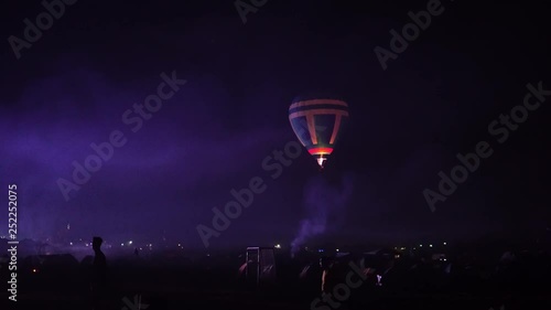 a balloon launch at night at a concert