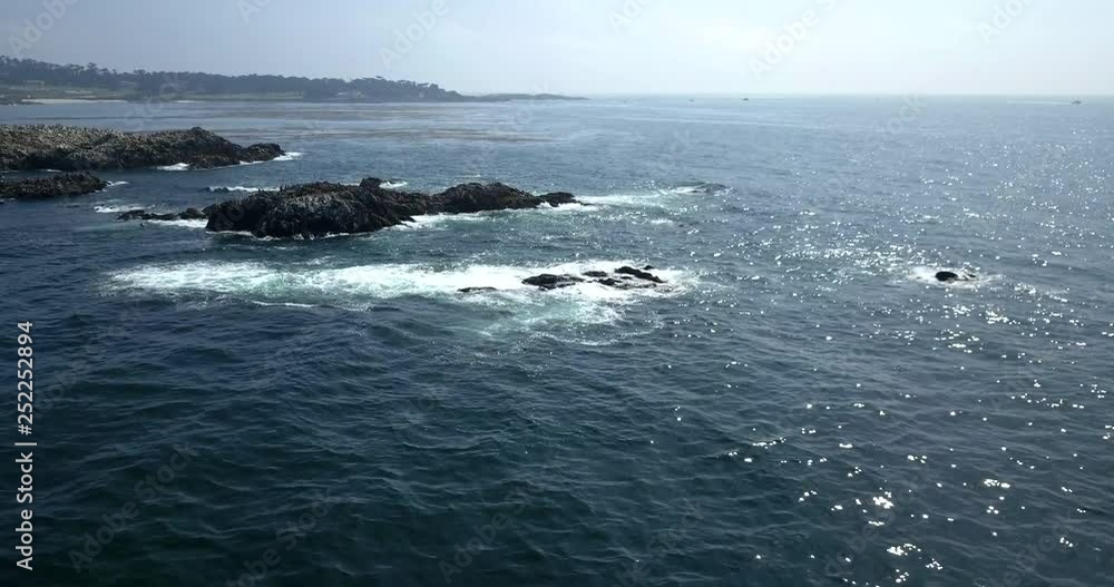 rock formation just off of ocean coast - aerial shot rock formation just off of ocean coast - aerial shot