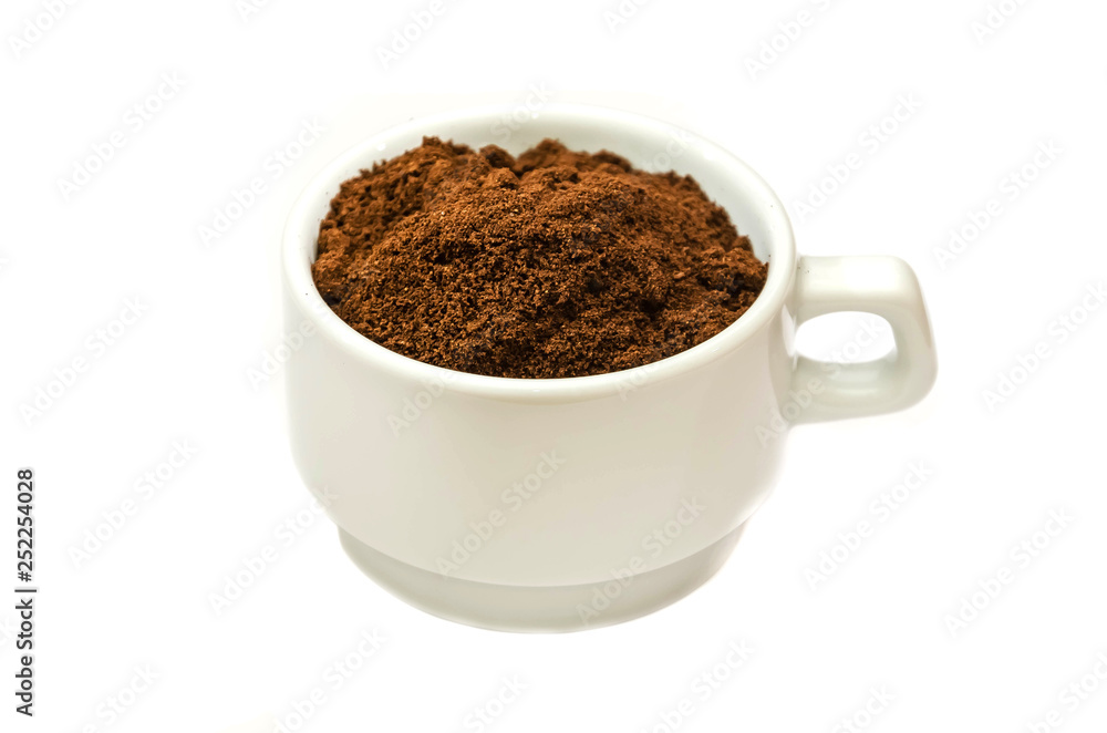 ground coffee in a white cup on a white background ground coffee in a white cup on a white background