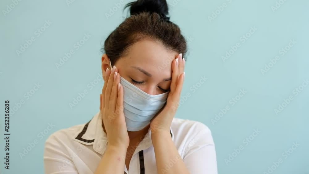 close up face Sick asian woman suffering from headache and wearing a mask. dust allergy. polluted air. slow motion close up face Sick asian woman suffering from headache and wearing a mask. dust allergy. polluted air. slow motion