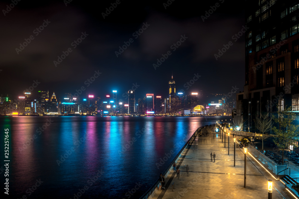 Hong Kong cityscape at night. Victoria Harbor of Hong Kong city at night