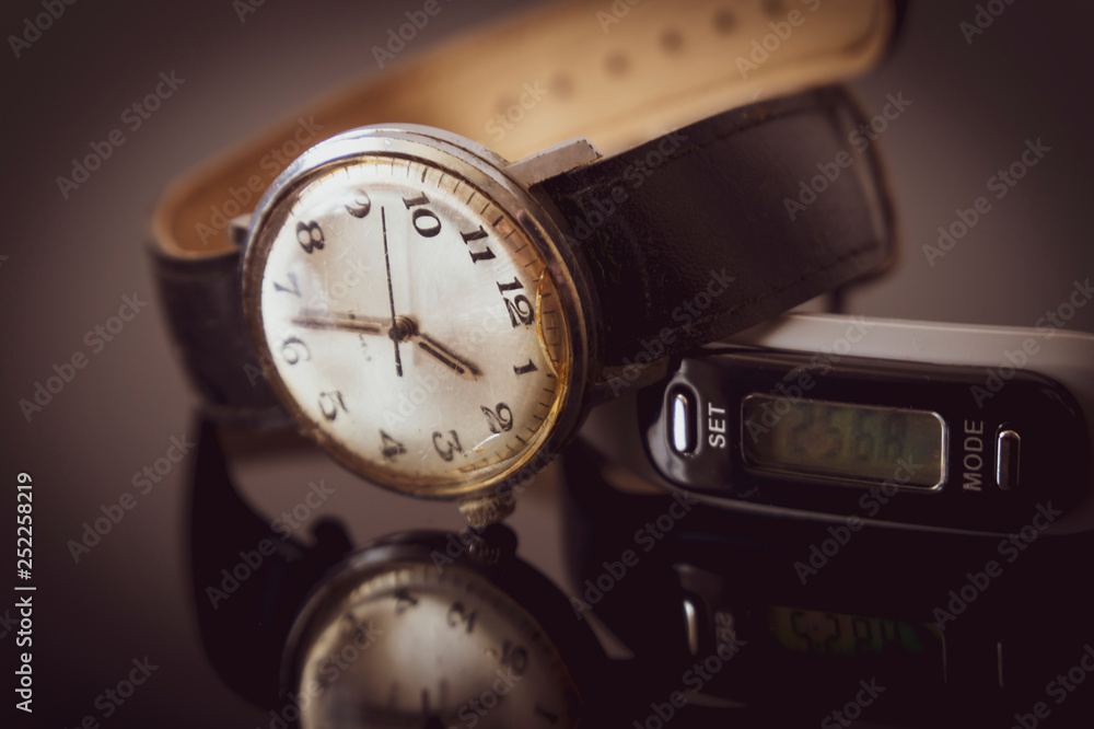 Dial of a wristwatch reflected on a table Dial of a wristwatch reflected on a table
