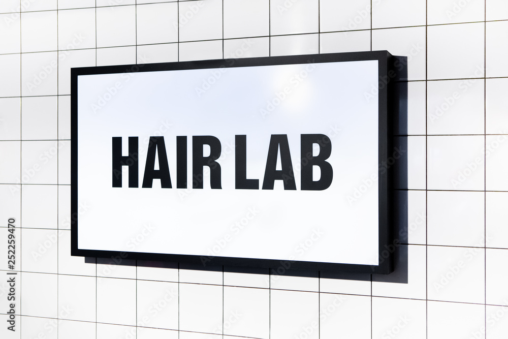 Illuminated Display Or Sign With Words - Hair Lab On White Tile Wall. Concept Of Professional Hair Care And Hairdressing. Black And White Sign. Illuminated Display Or Sign With Words - Hair Lab On White Tile Wall. Concept Of Professional Hair Care And Hairdressing. Black And White Sign.