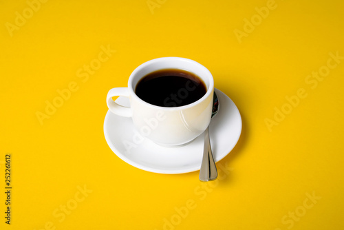 Cup of coffee drink on yellow background
