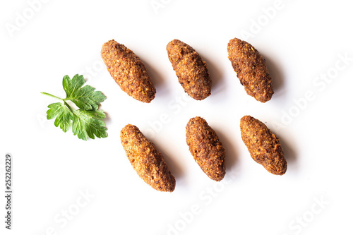 Arab cuisine: meat appetizer quibe close-up on a plate. - Image photo