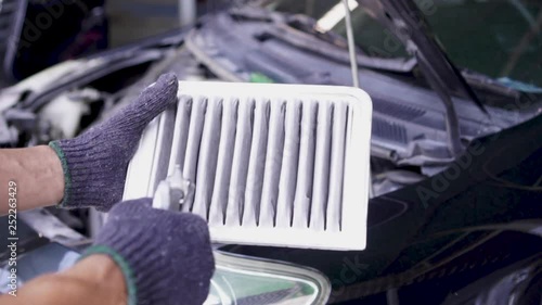 Men are using the blower to clean the air filter car. 