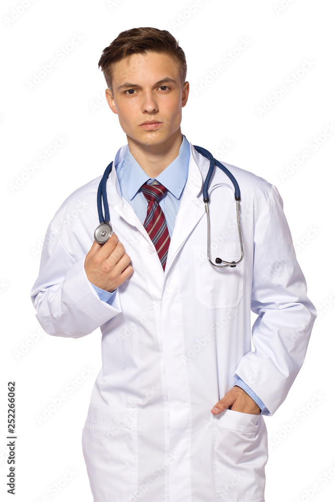 Young medic doctor - serious man in white gown with stetoskope Young medic doctor - serious man in white gown with stetoskope