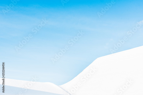 clear blue sky with peaks of carpathian mountains covered with snow