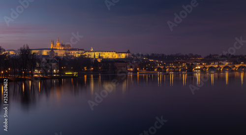 Evening view of Prague Castle and Charles Bridge over Vltava river © Kennymax