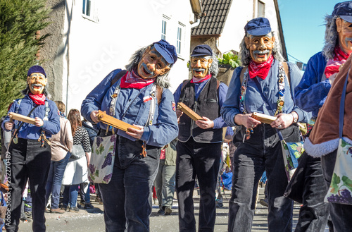 Traditionelle Kostüme der schwäbisch-alemannischen Fasnet mit Holzmasken bei einem Festumzug in Ammerbuch, Baden-Württemberg photo