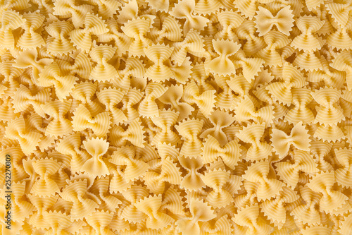 Obraz na płótnie Dried bow tie pasta background w salonie
